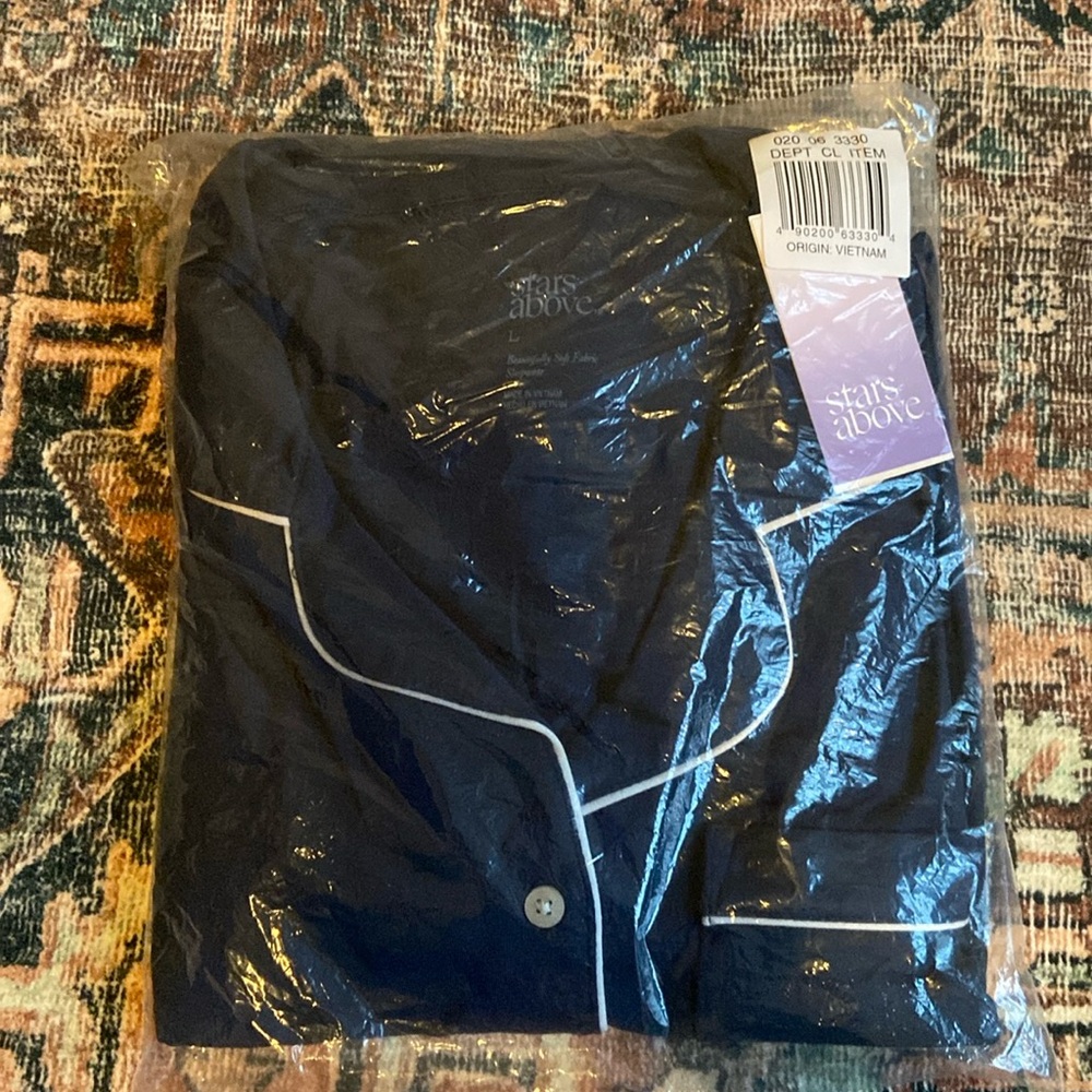 NWT target stars above pajama set. Short sleeve top and pant bottom, size large